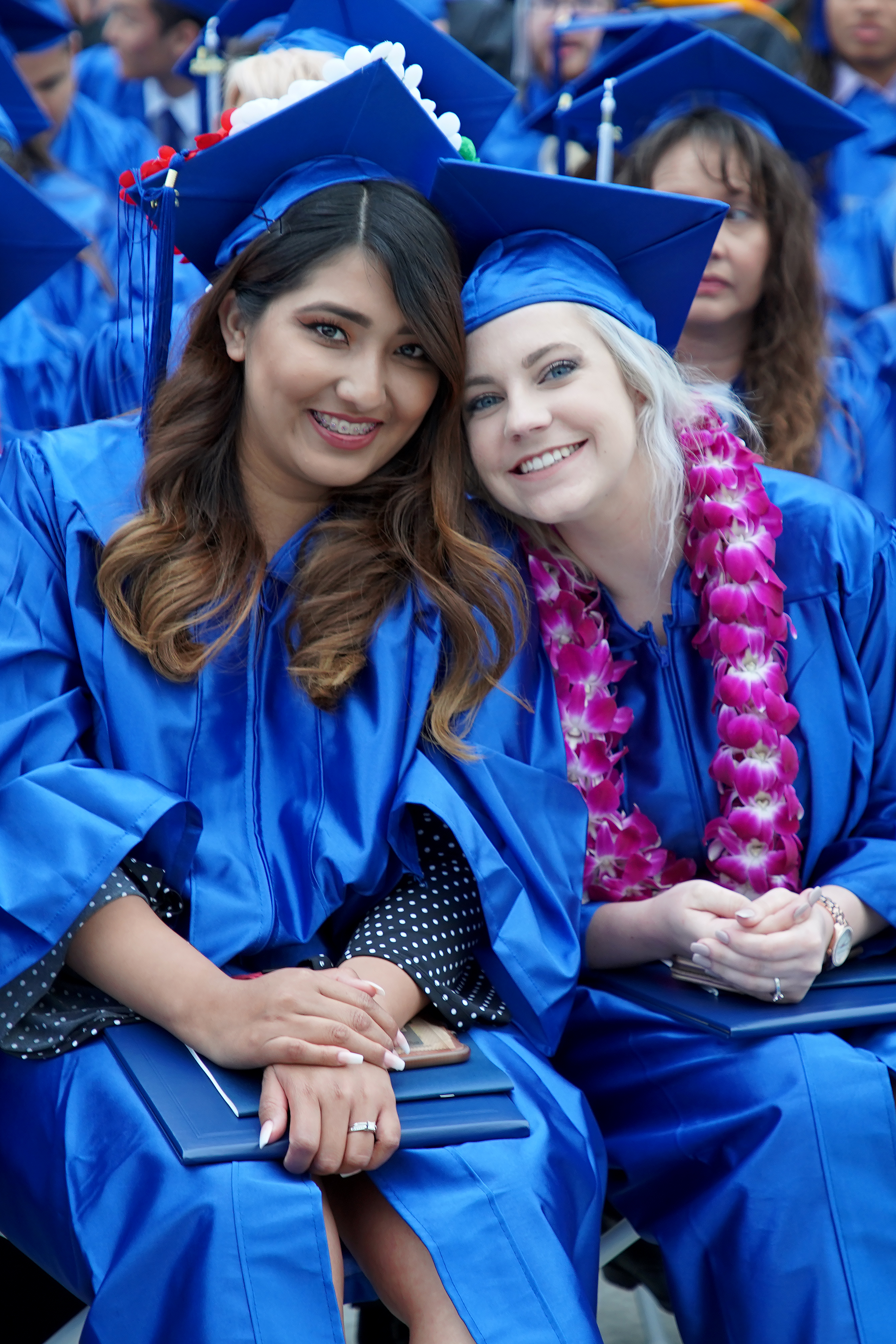 Photo showing two graduating students
