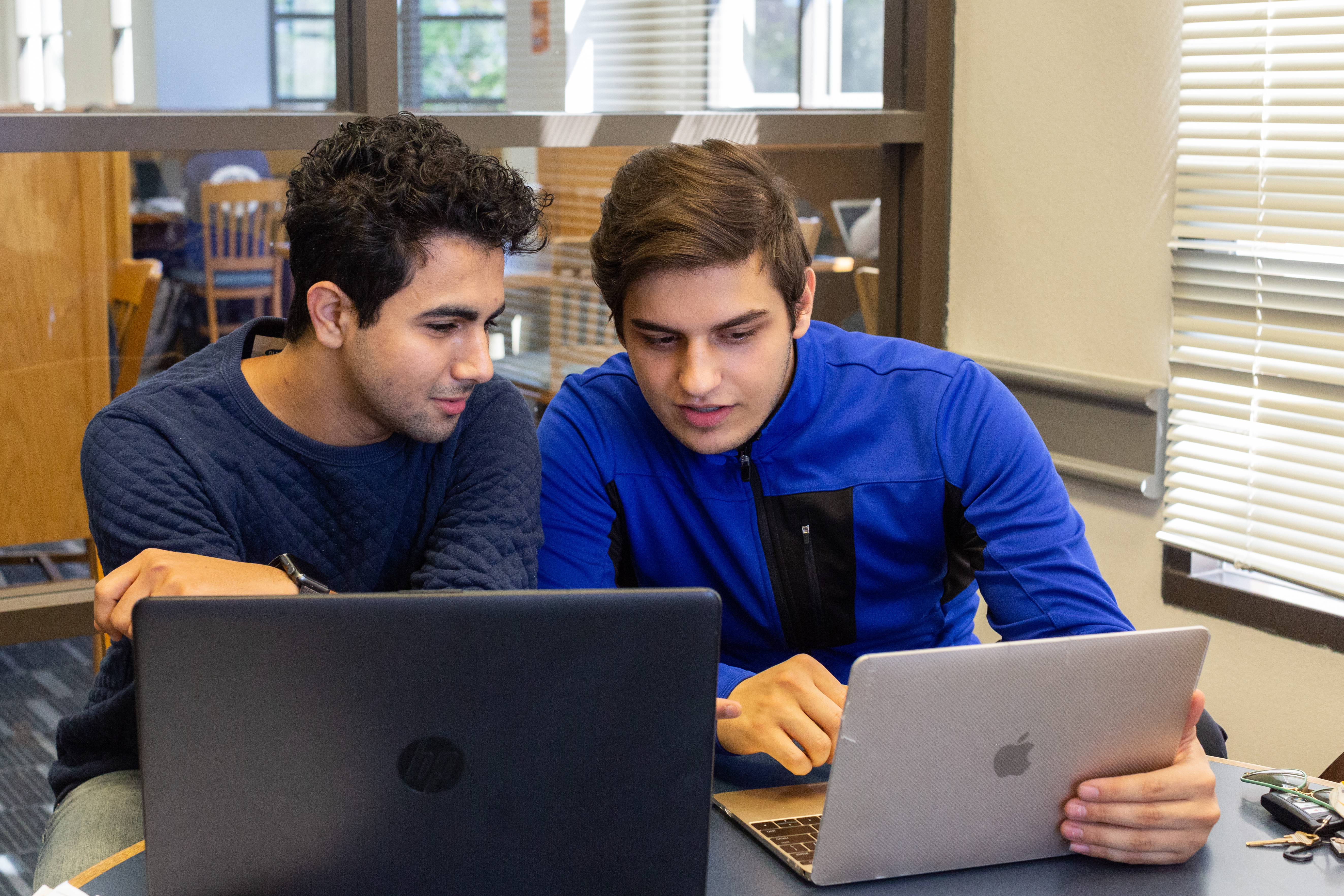 Photo showing students working on computer